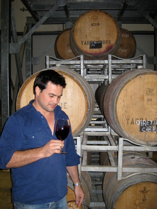 Alex in front of barrels